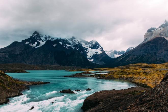 View of a river flowing next to mountains