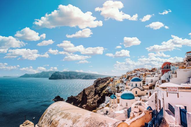 Village on a cliff by the sea on the island of Mykonos.