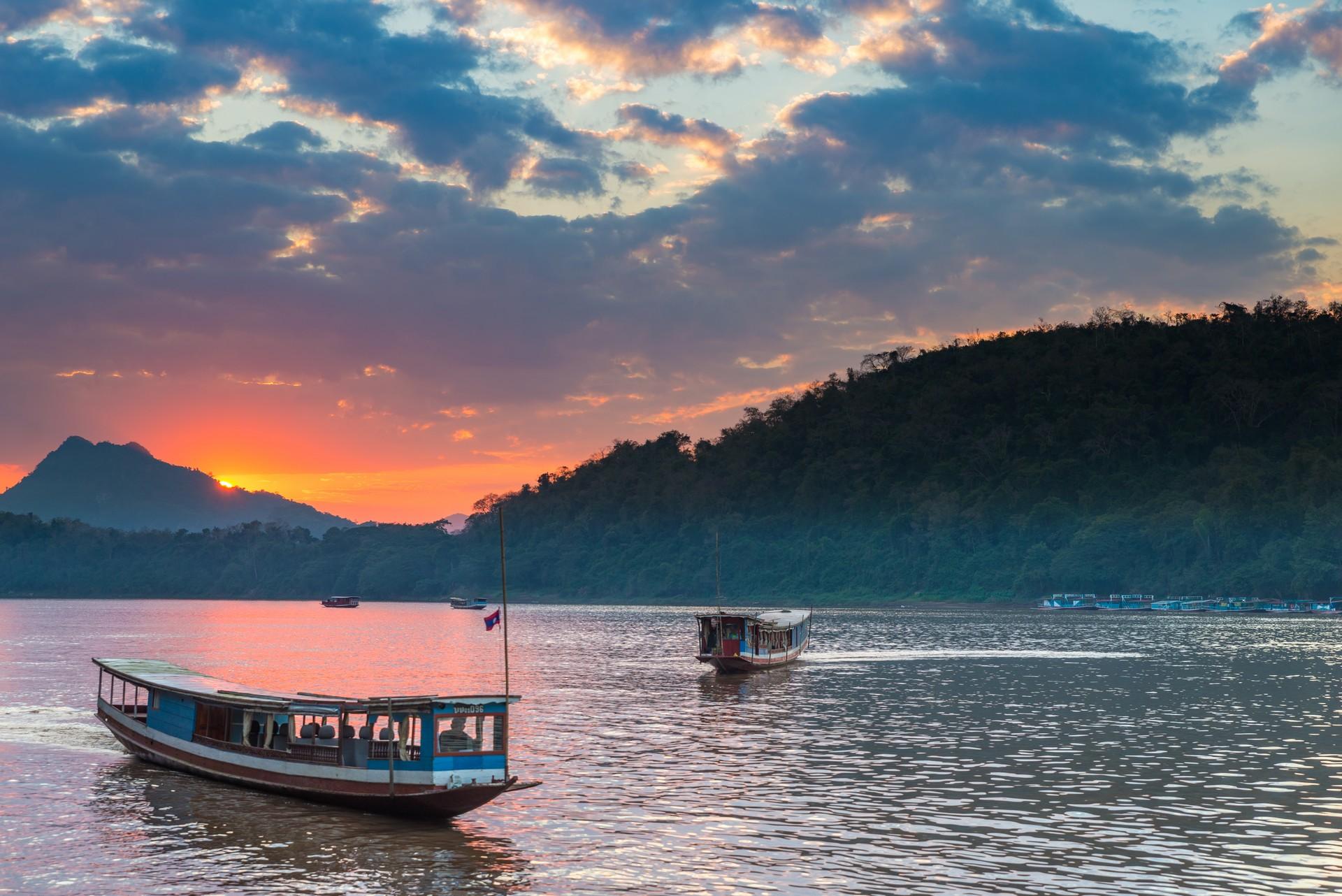 Boat near Louangphrabang at sunset time