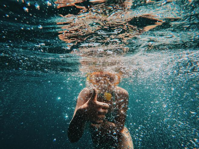 A person snorkeling under water.