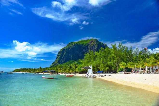 A view of a mountain and a white beach in Mauritius