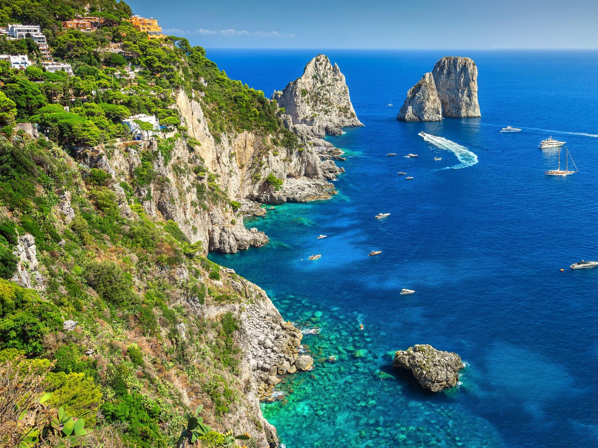 Aerial view of beach in Capri on a sunny day with some clouds