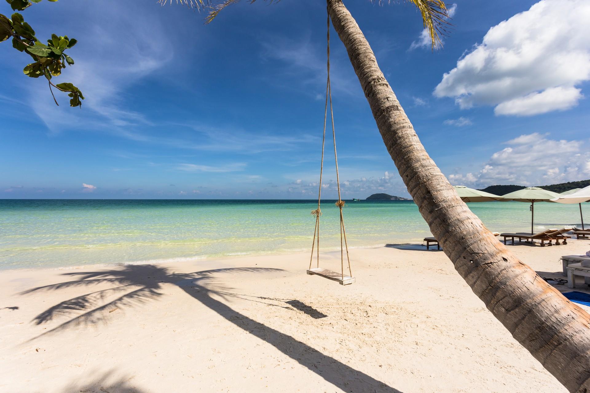 Nice beach by the sea in Phu Quoc in sunny weather with few clouds