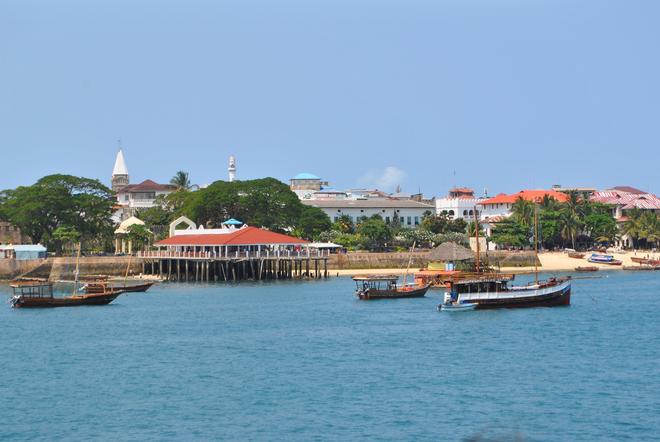 Stone town, Zanzibar: view from the sea with boats.