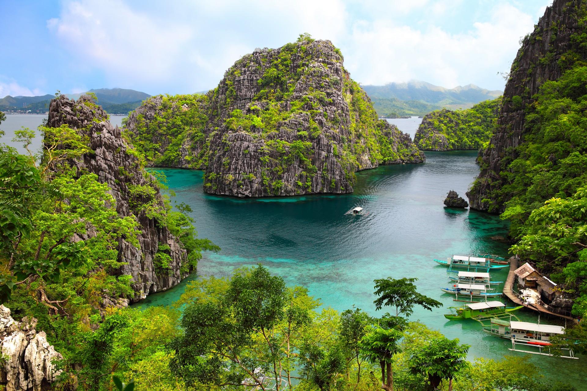 Aerial view of lake in Coron in sunny weather with few clouds