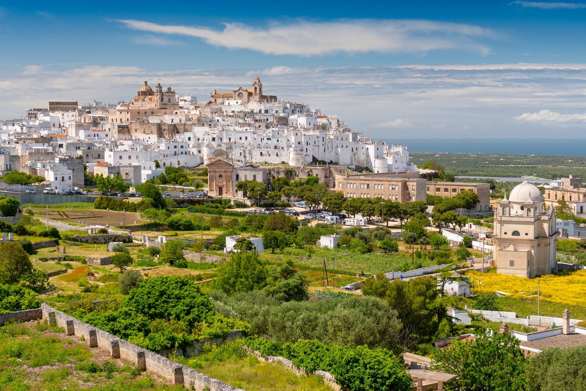 Aerial view of architecture in Ostuni on a sunny day with some clouds