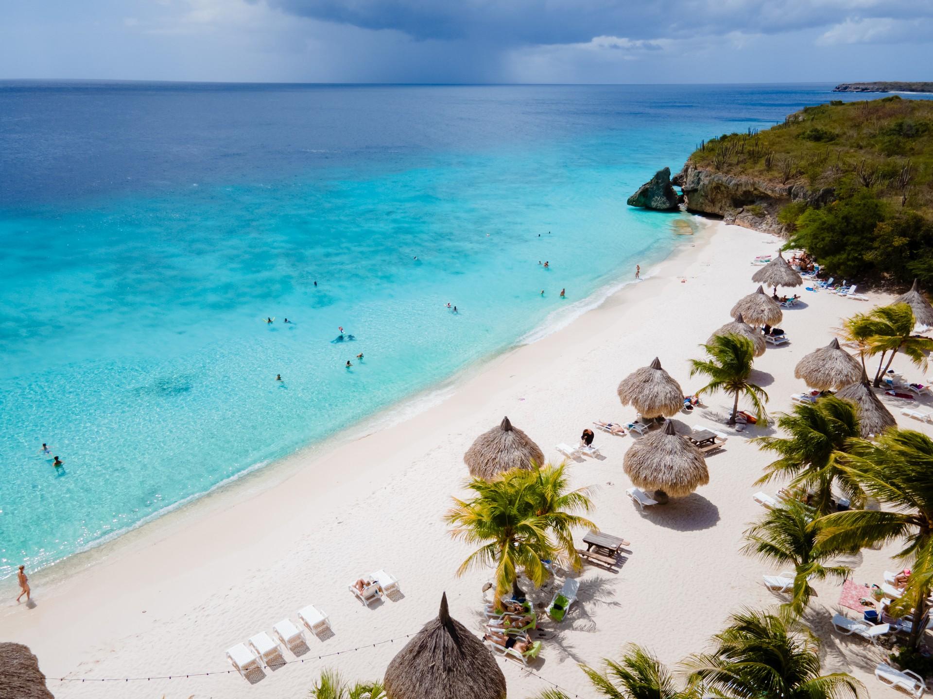 Awesome beach with turquise sea near Willemstad on a cloudy day