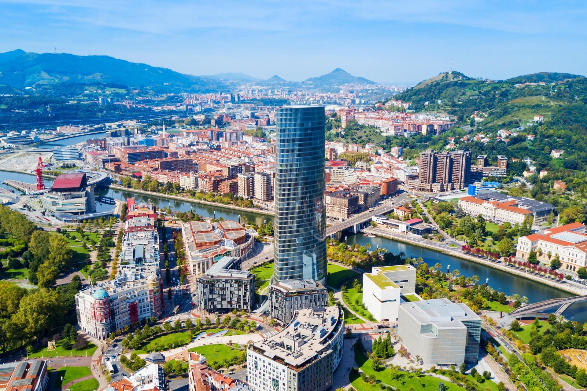 Aerial view of architecture in Bilbao in sunny weather with few clouds