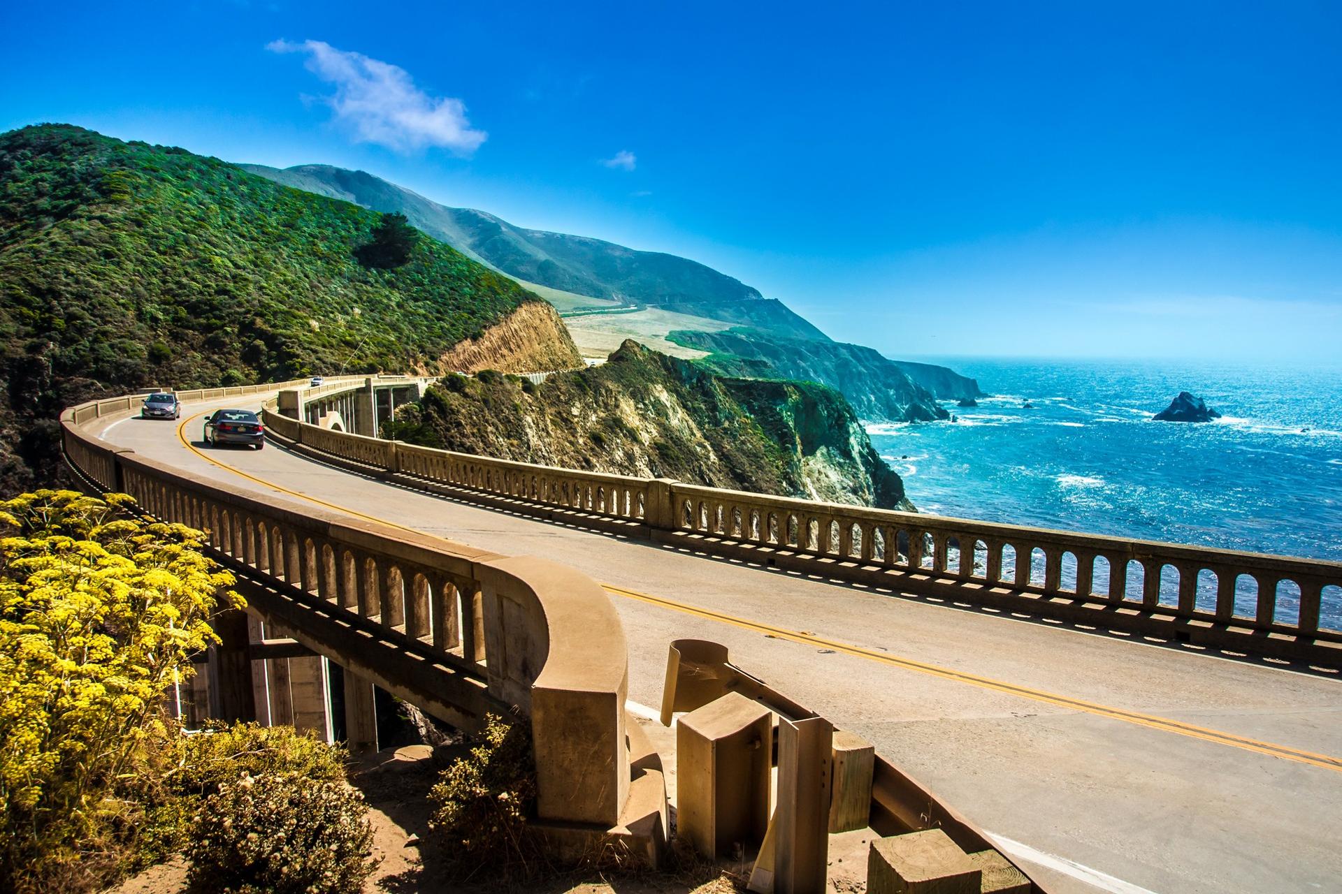 Beach and bridge near Monterey in partly cloudy weather