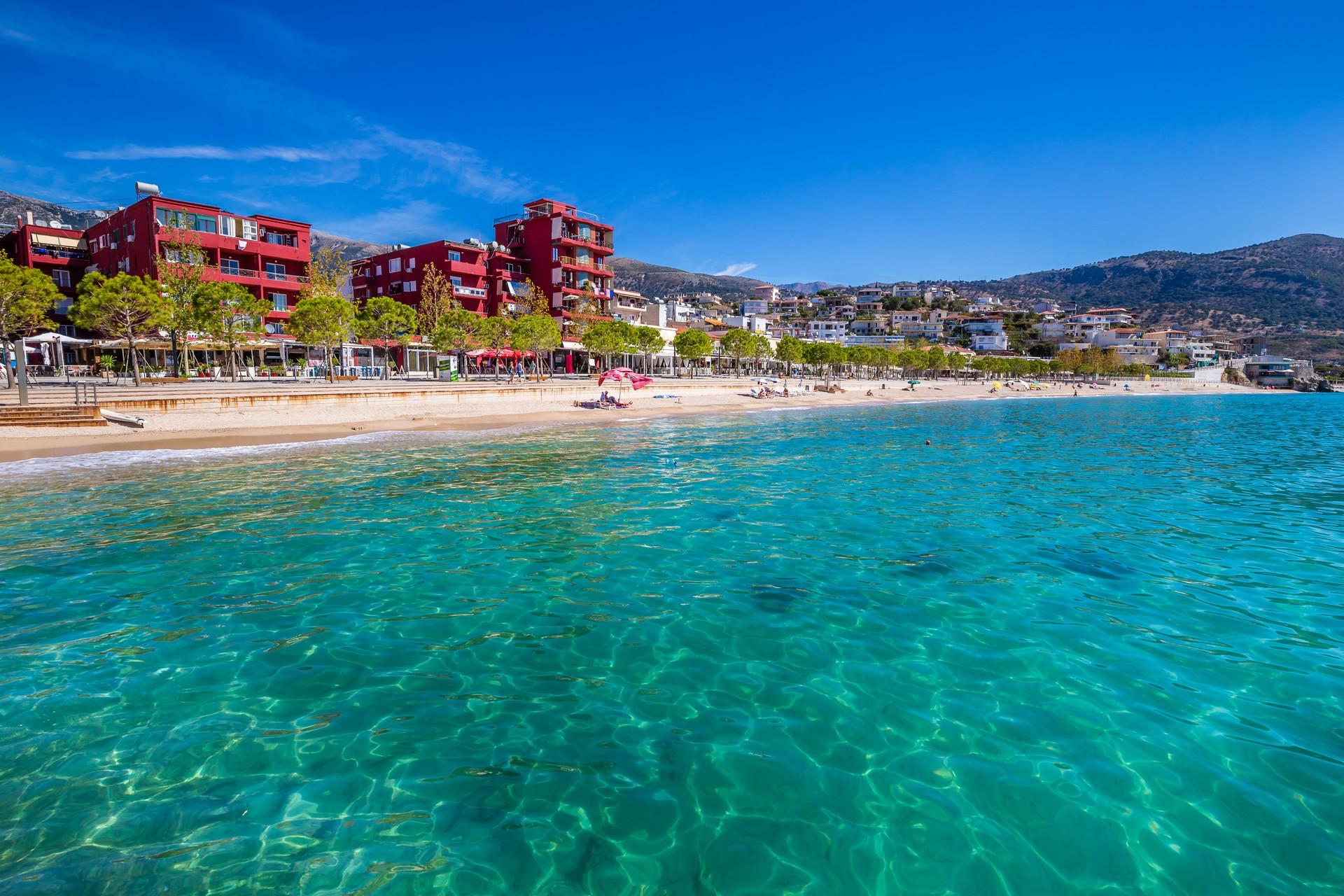 Beach with turquise sea in Himarë on a sunny day