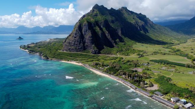 Kualoa Beach, Oahu, Hawaii: majestic mountain by the green coast.