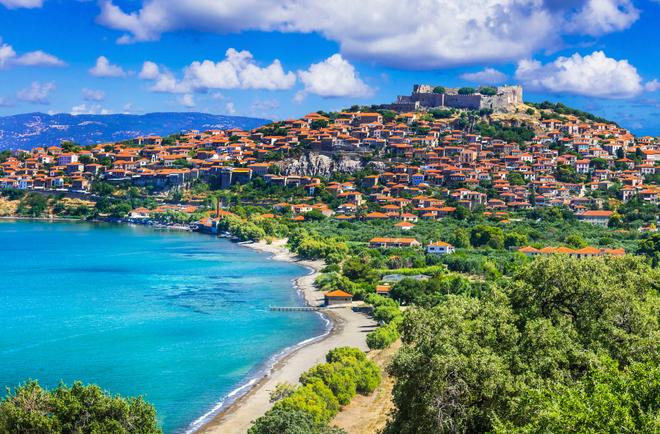 Beautiful view of the seaside town with fortress and beach on Lesbos island.