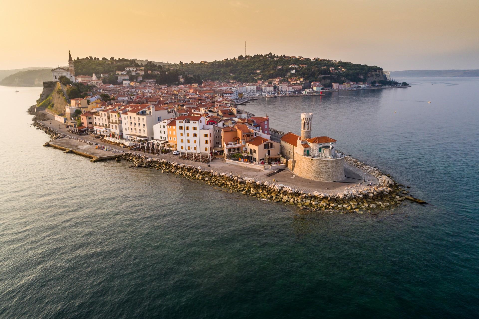 Aerial view of beach in Piran at sunset time