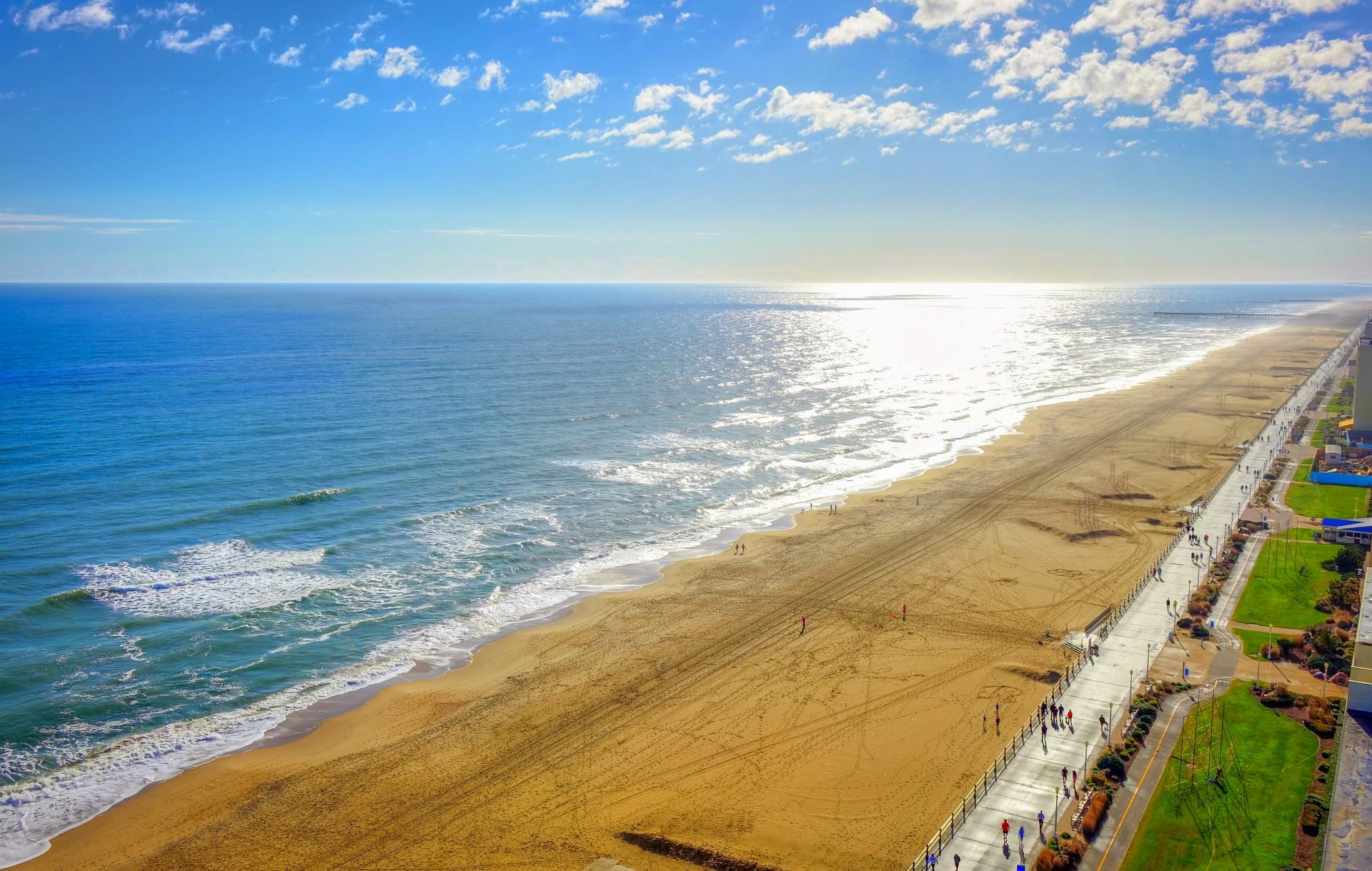 Aerial view of amazing beach in Virginia Beach on a sunny day with some clouds
