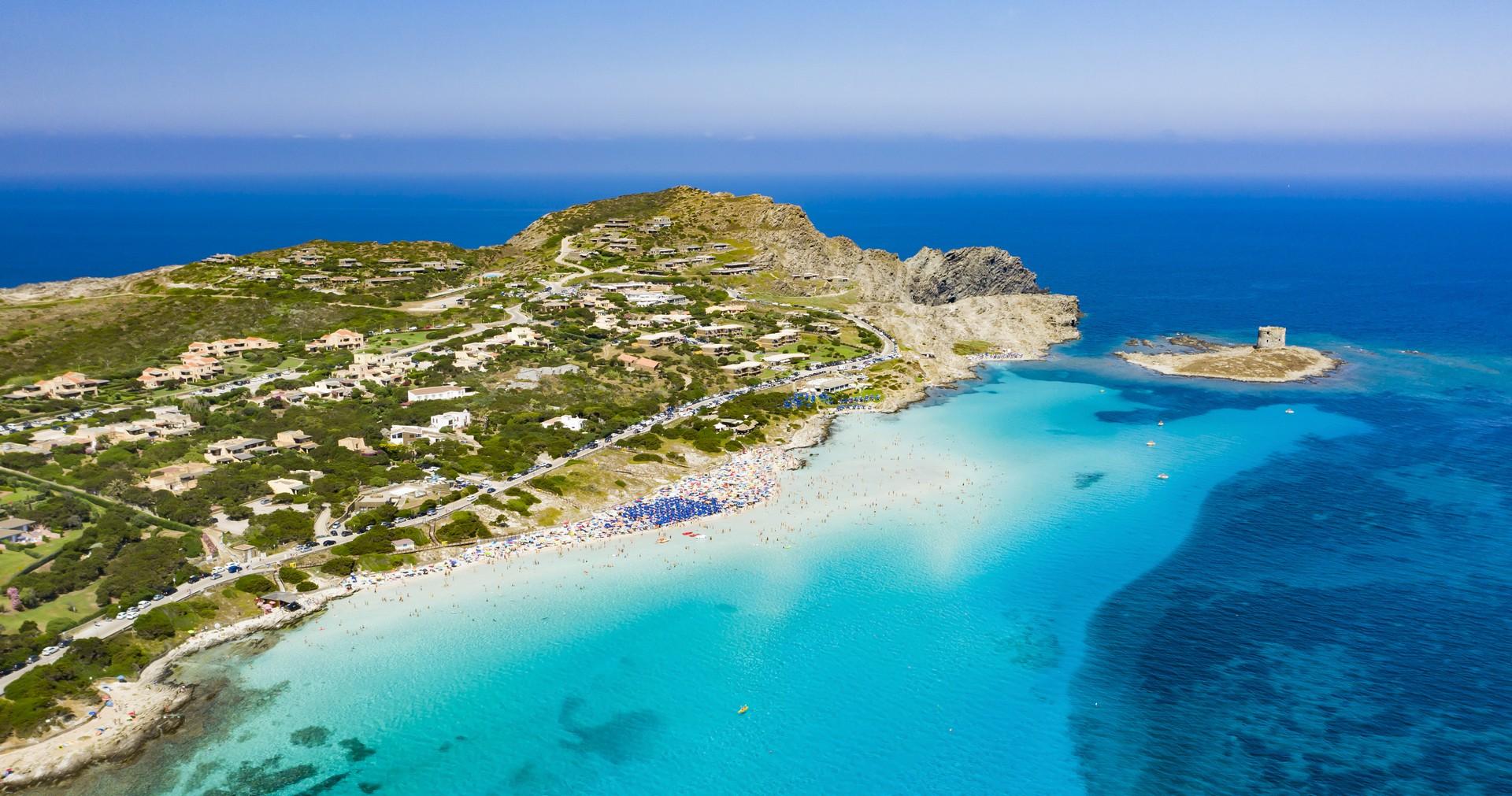 Aerial view of amazing beach in Stintino on a sunny day with some clouds