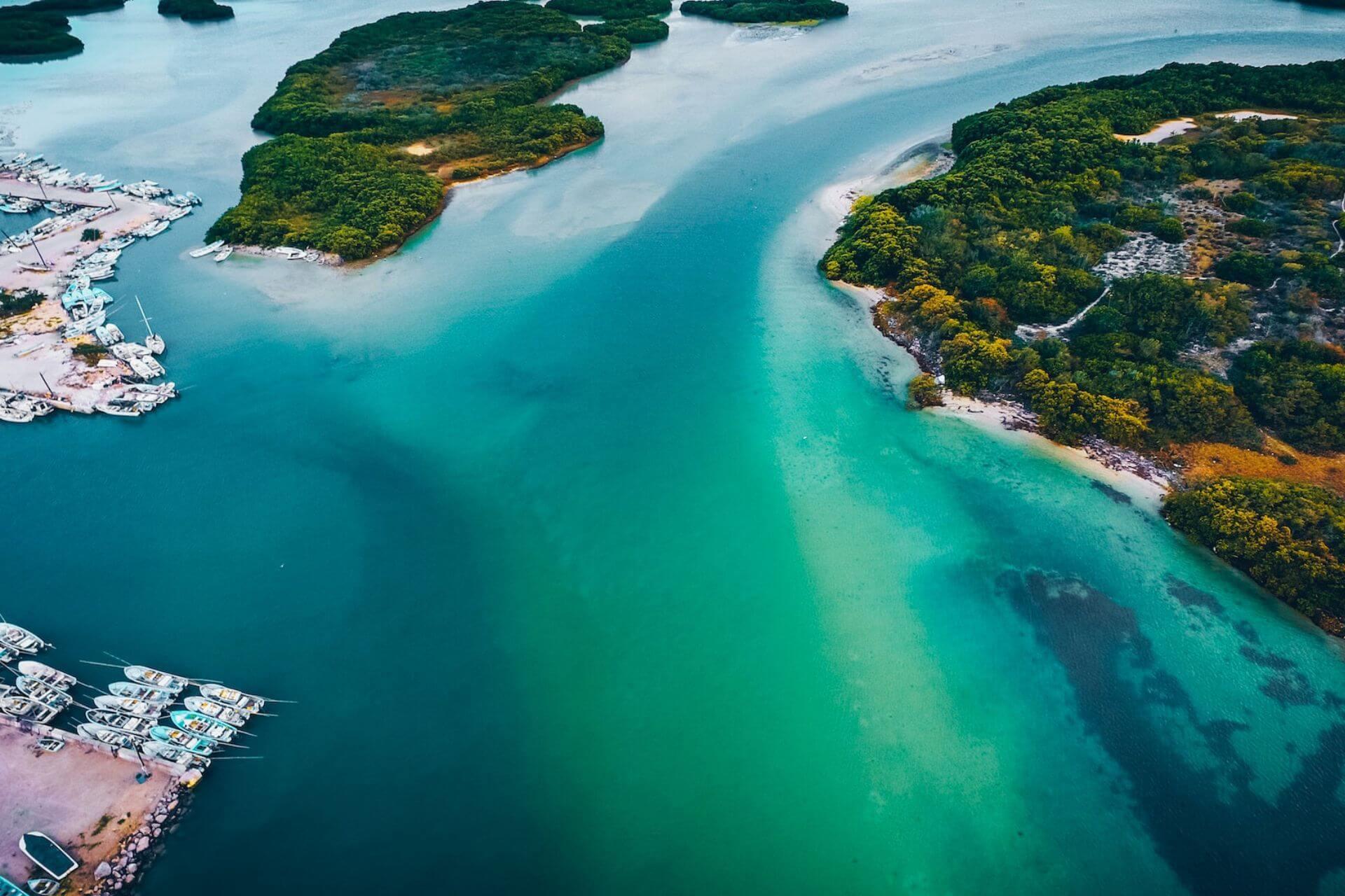 An Aerial view of turquoise sea, boats and Yucatán peninsula