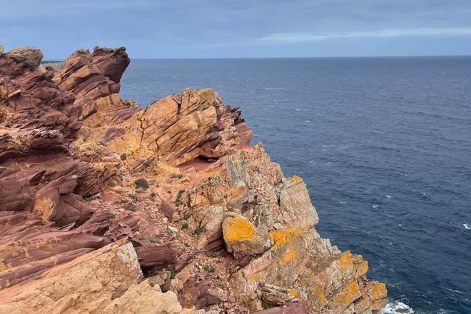 Rocky formation surrounded by the sea on a Horse Trail in Menorca