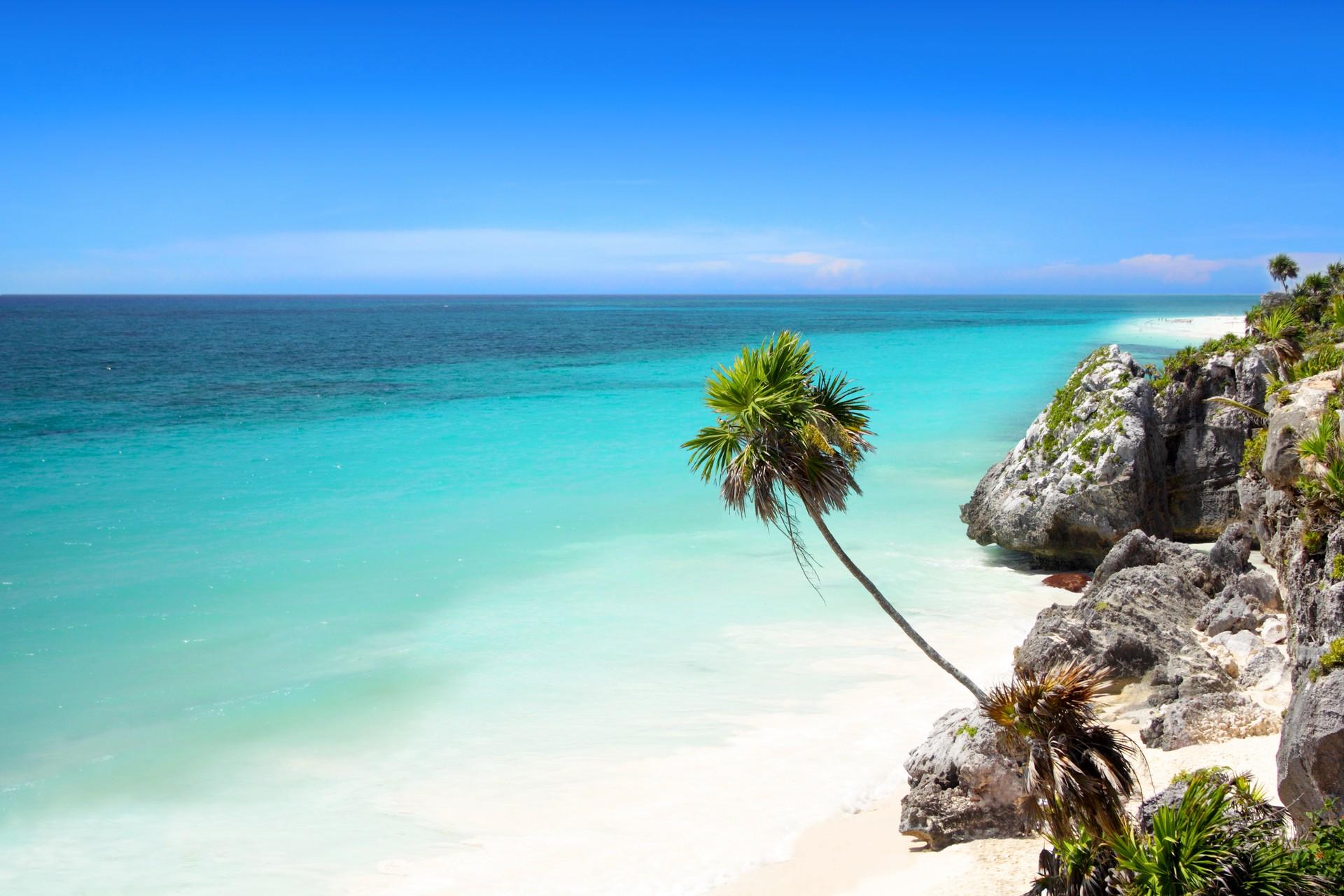 Awesome beach with turquise sea near Tulum in sunny weather with few clouds