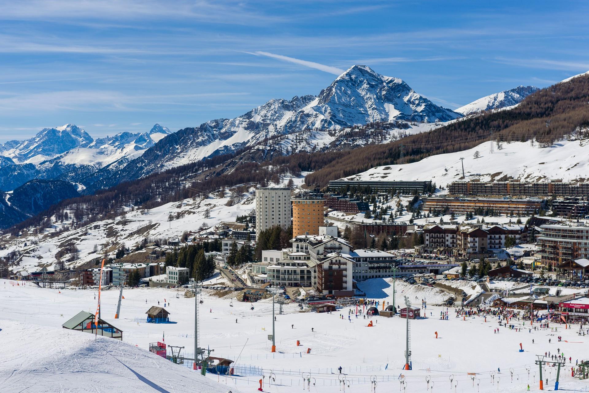 Mountain range in Sestriere in sunny weather with few clouds