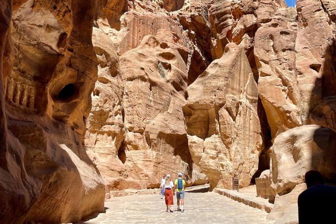 View of people walking through a mountain valley in Jordan