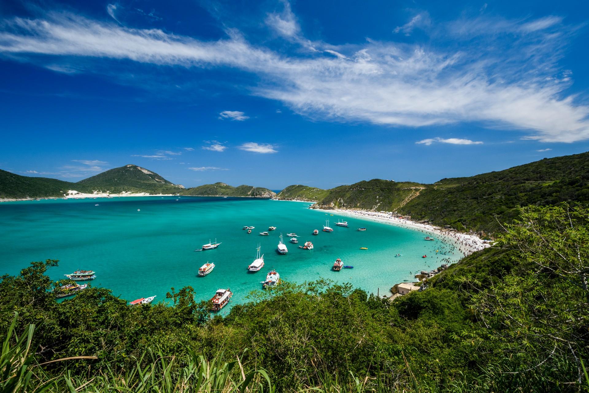 Beach with turquise water in Arraial do Cabo on a sunny day with some clouds