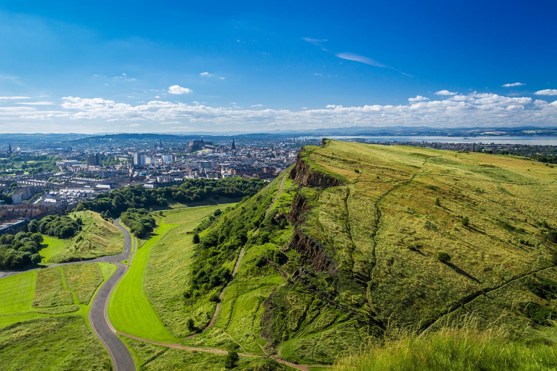 Aerial view of countryside in Edinburgh on a sunny day with some clouds