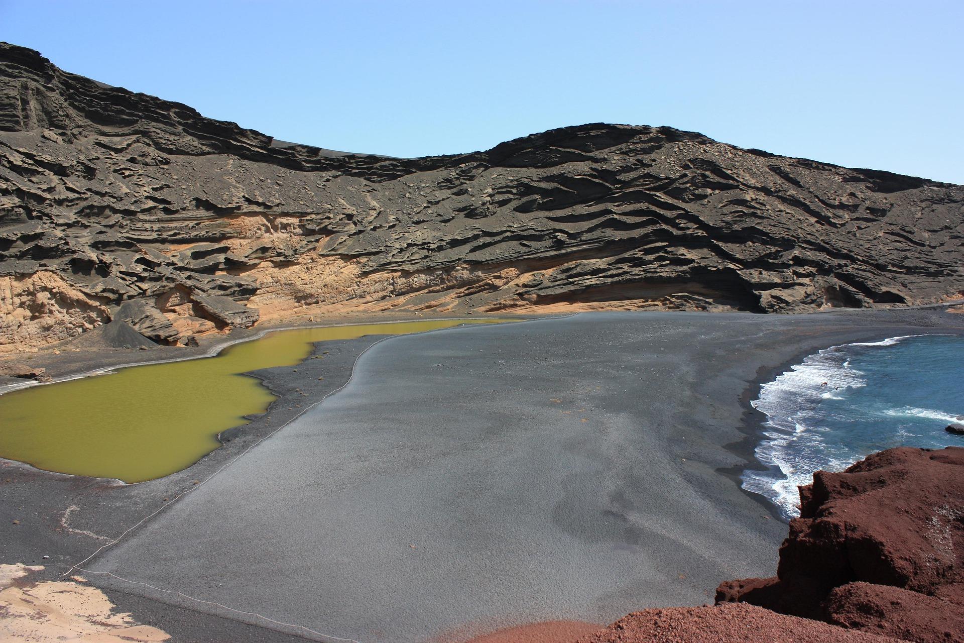 Bay with volcanic beach on Lanzarote.