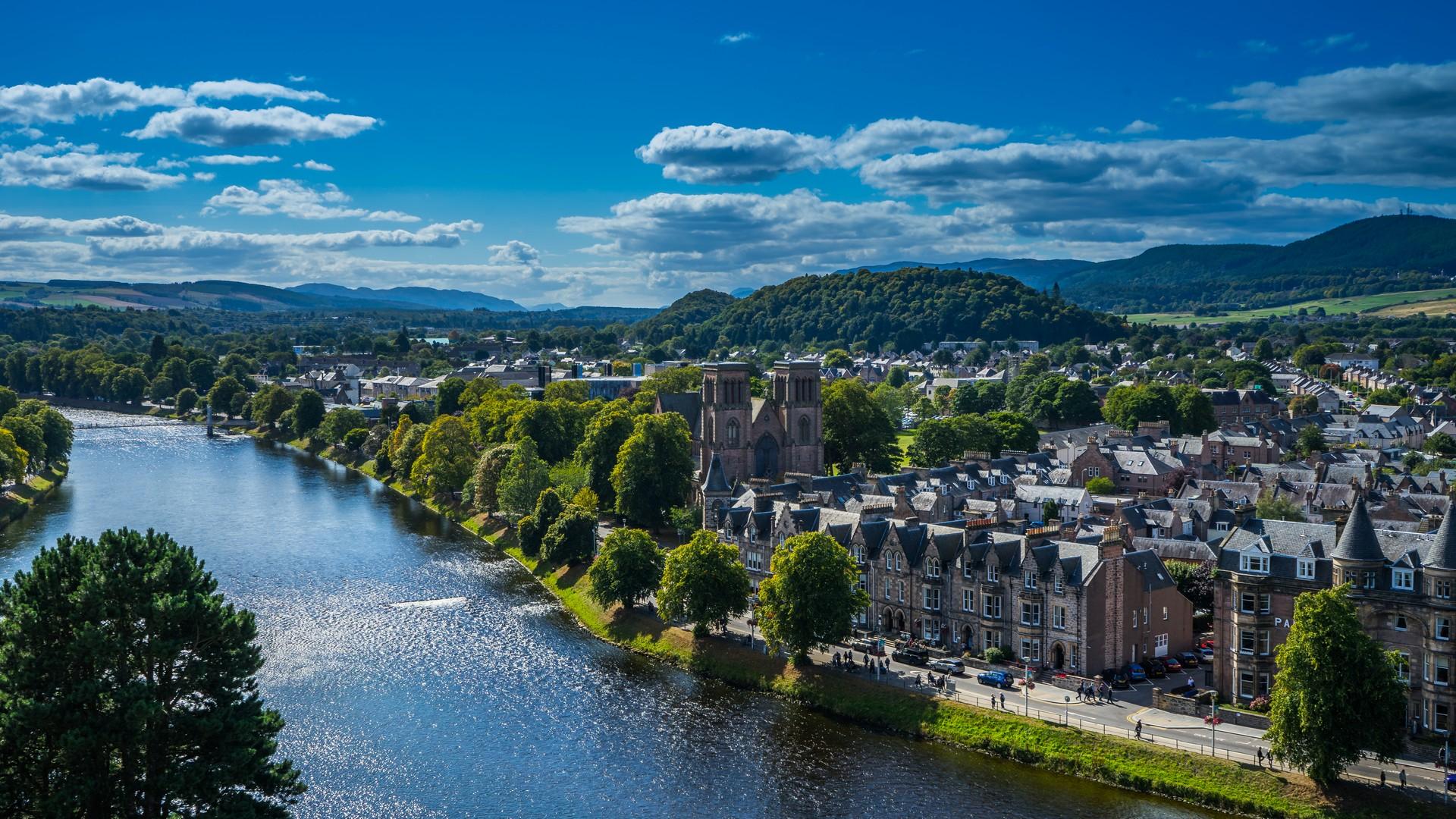 Aerial view of architecture in Inverness in sunny weather with few clouds