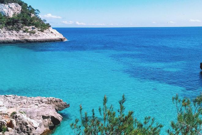 View of a crystal-clear sea and some cliffs in Menorca