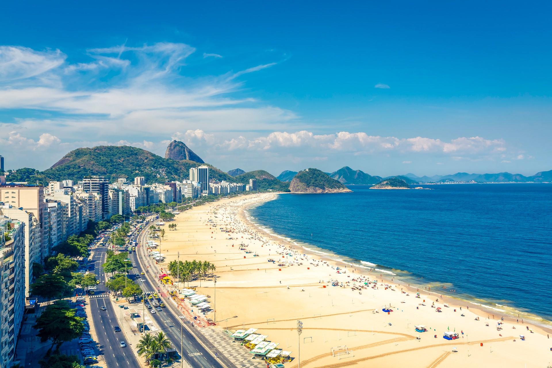 Aerial view of people on the beach in Rio de Janeiro in partly cloudy weather