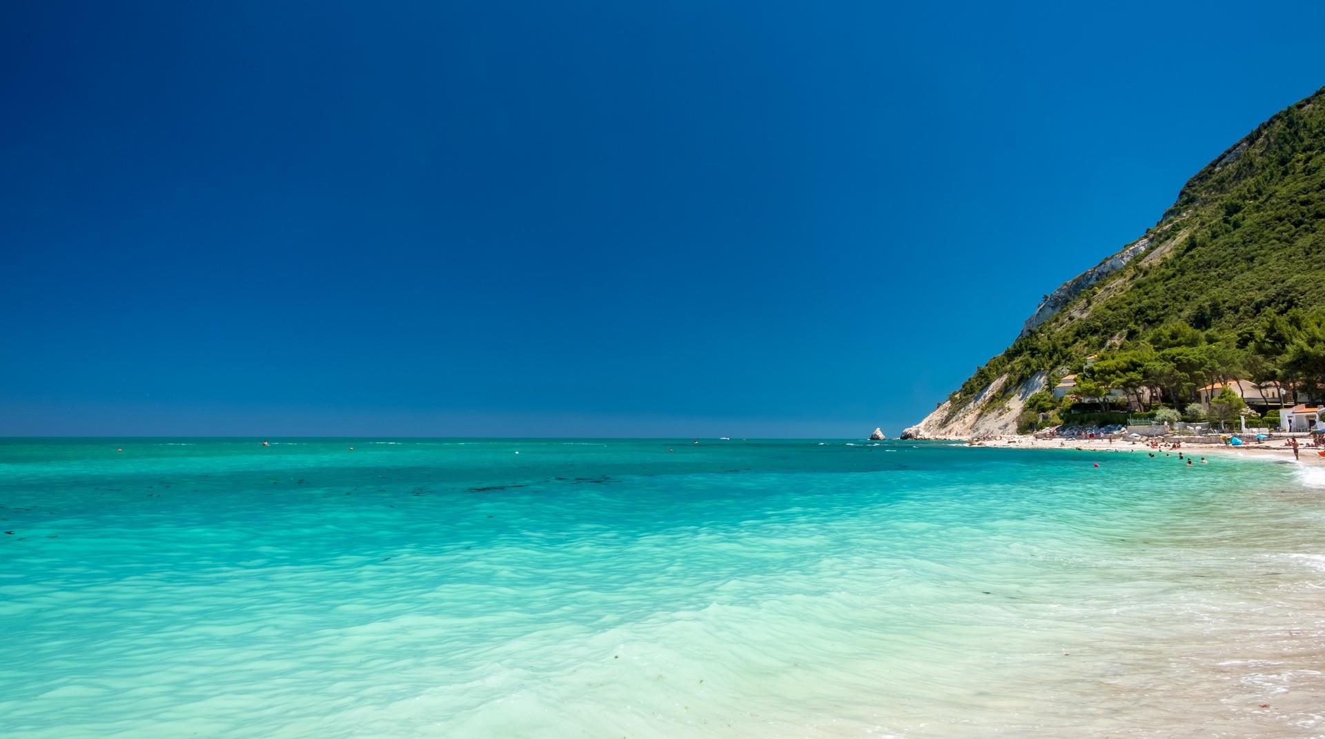 Beach with turquise sea in Numana on a sunny day
