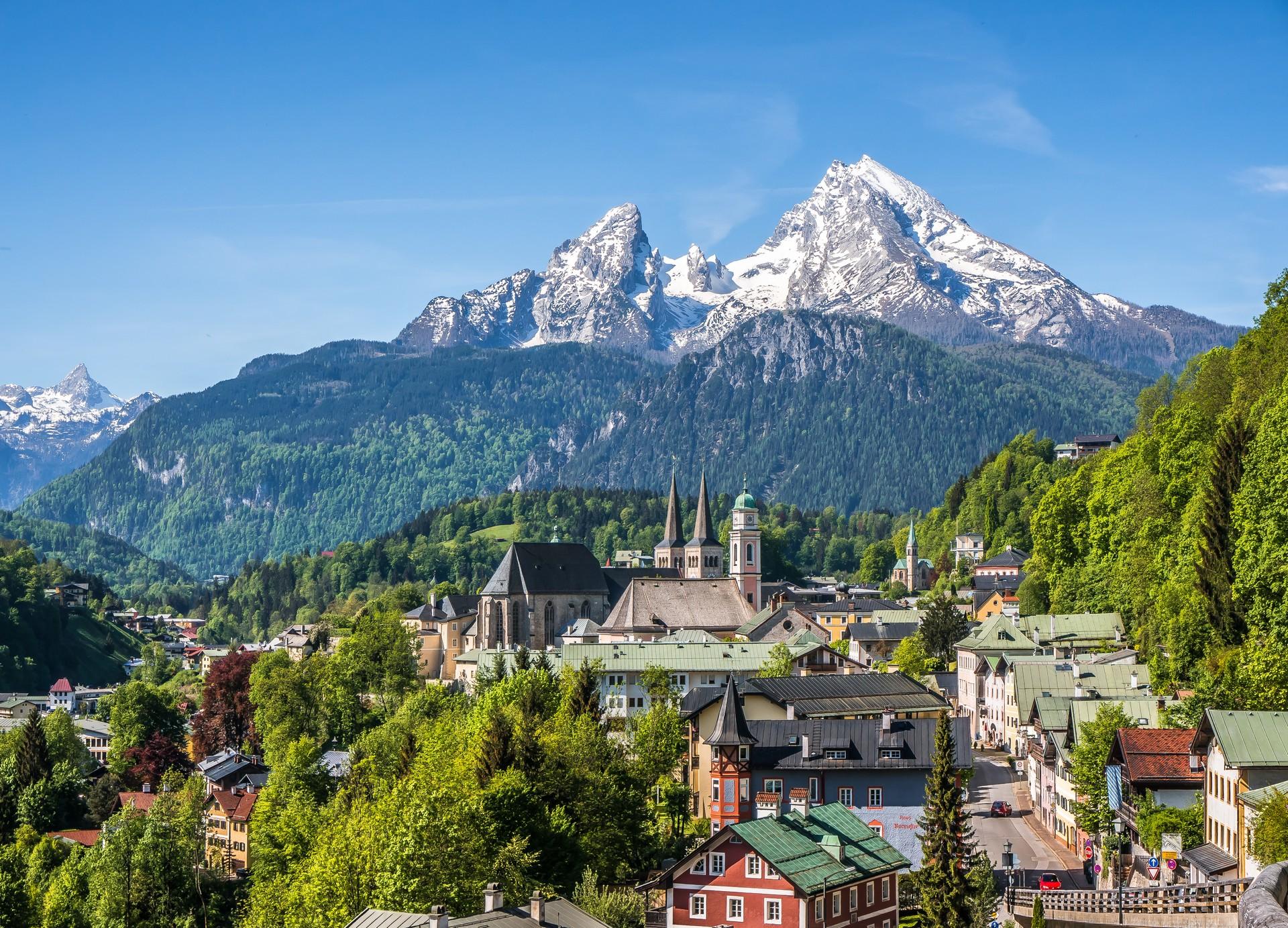 Aerial view of mountain range in Berchtesgaden on a sunny day with some clouds