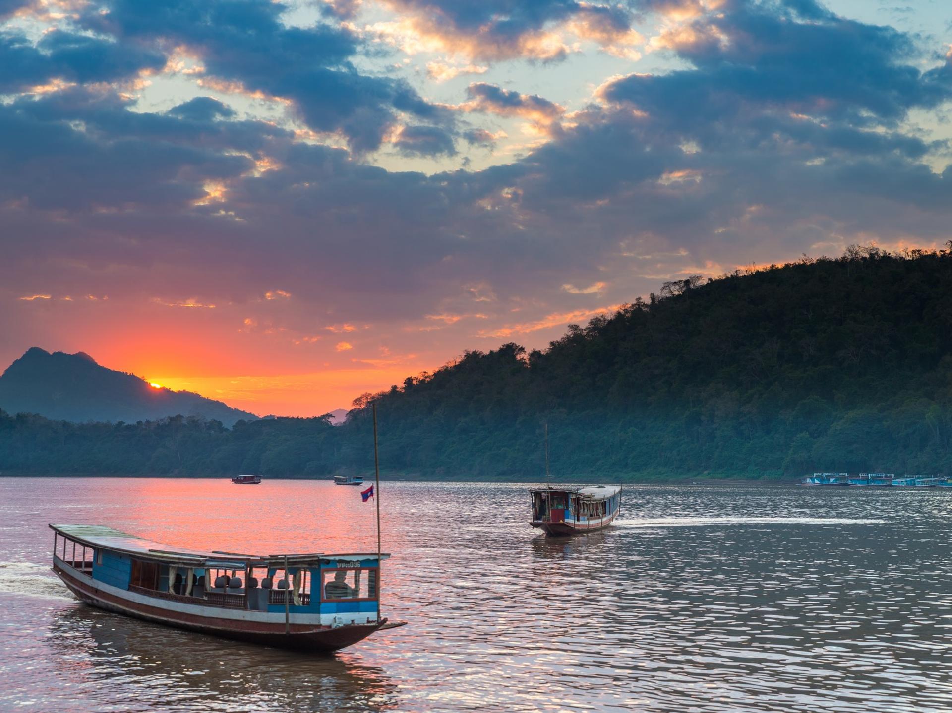Boat near Louangphrabang at sunset time