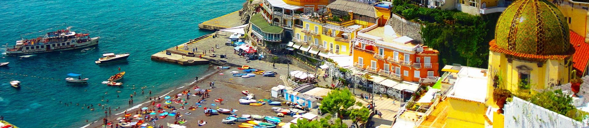 Aerial view of boat in Positano in sunny weather with few clouds