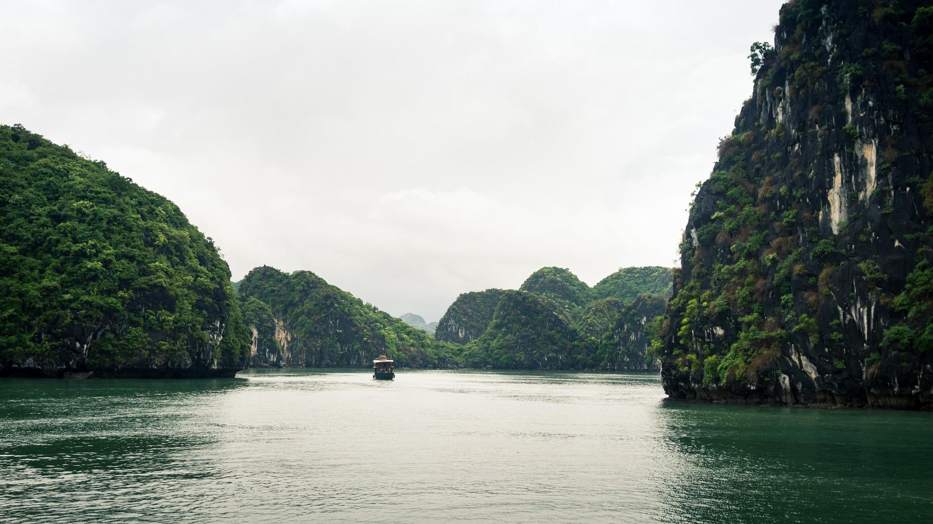 Boat in Ha Long with cloudy sky