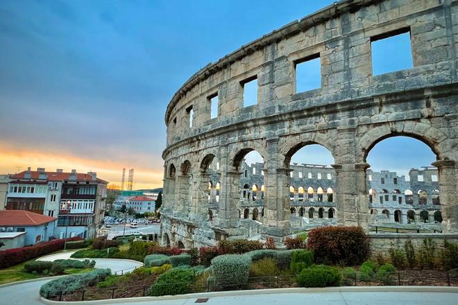 View of the Amphitheatre in Pula, at sunset
