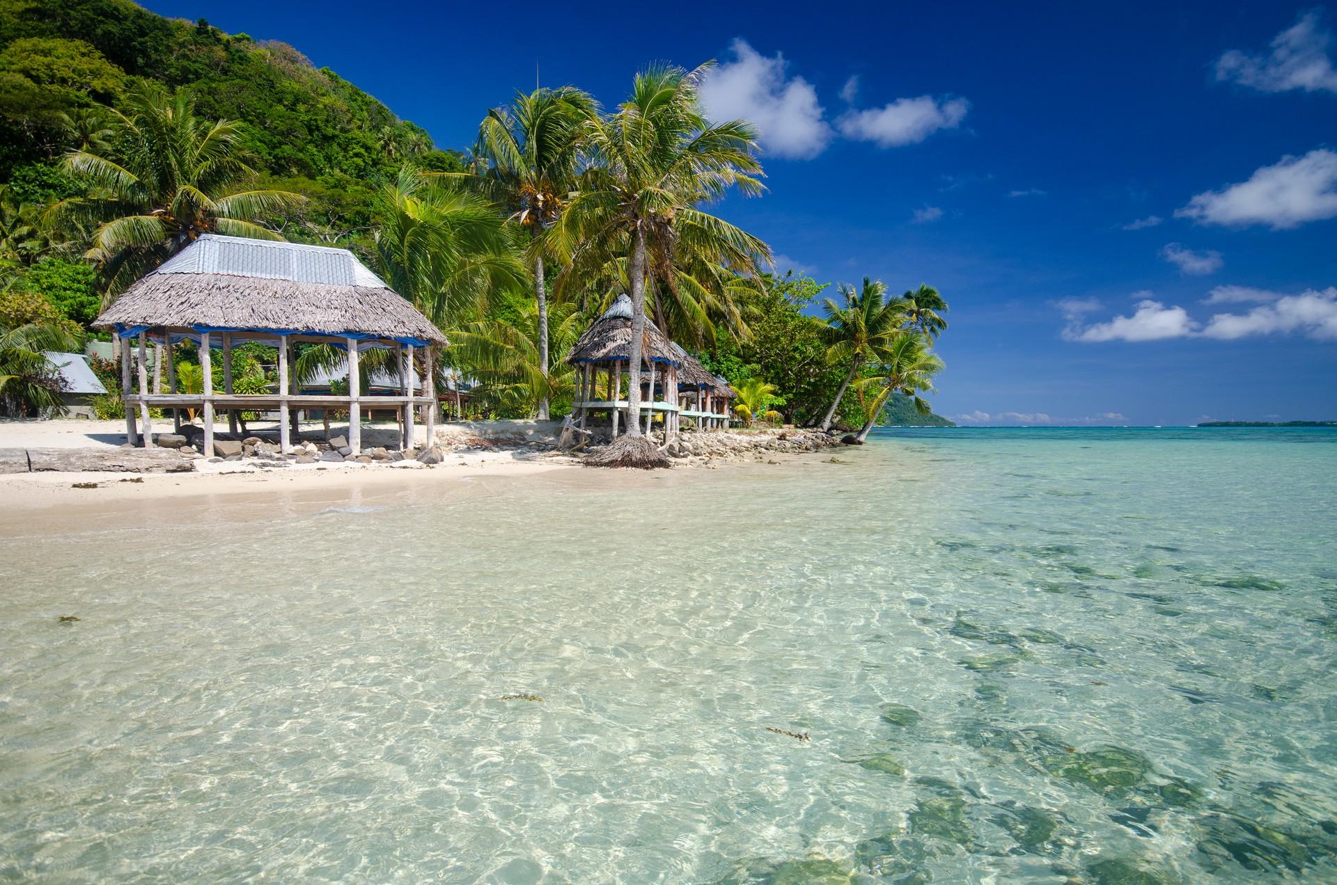 Beach in Samoa in sunny weather with few clouds