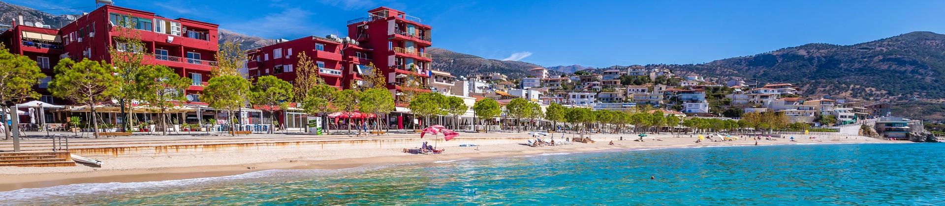 Beach with turquise sea in Himarë on a sunny day