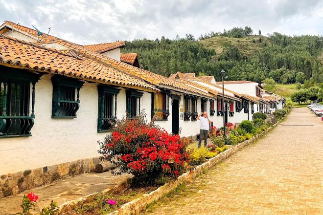 View of the houses, flowers and forest in the city of Pueblito, Colombia