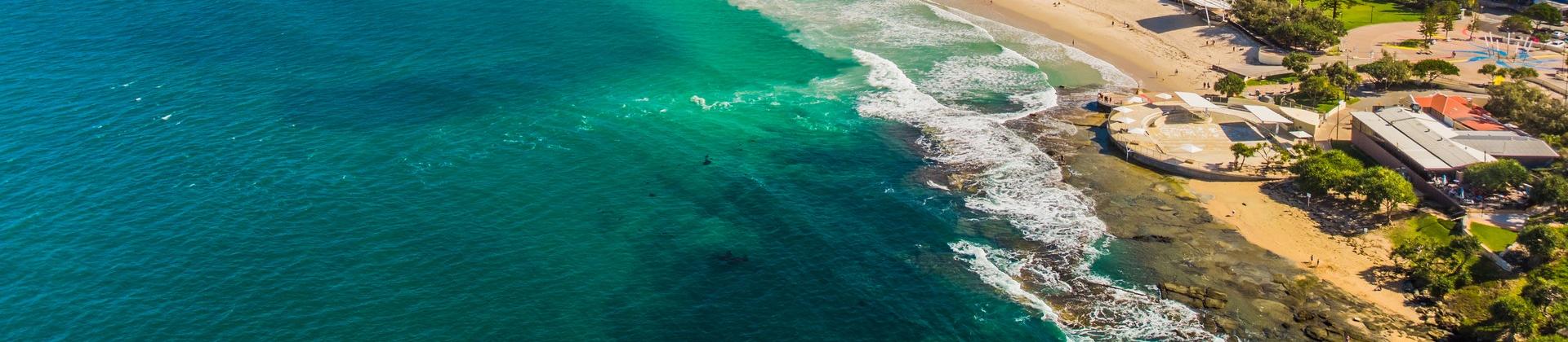 Enjoyable beach with turquise water in Caloundra on a sunny day with some clouds