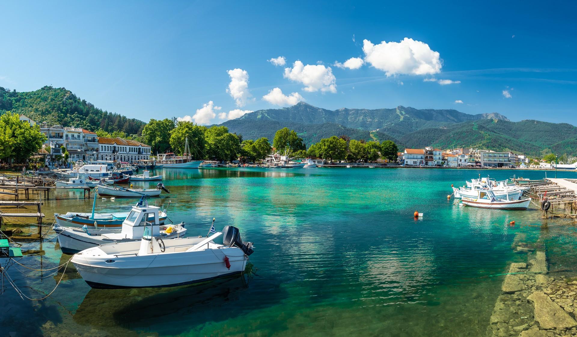 Boat in Thasos on a sunny day with some clouds