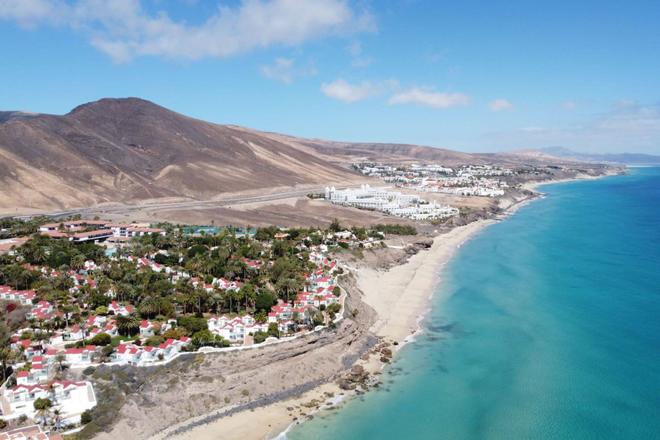 Aerial view of Morro de Jable city, palms, dunes and sea in Fuerteventura