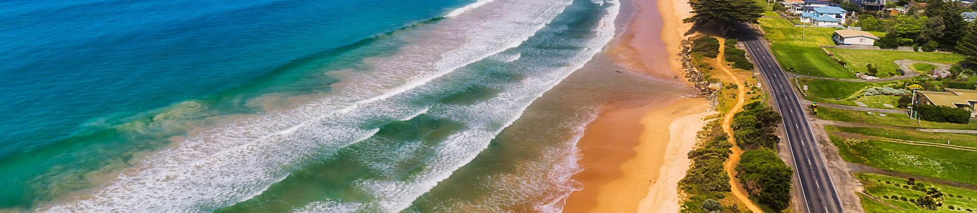 Aerial view of beach in Apollo Bay in sunny weather with few clouds