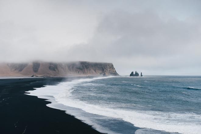 Iceland: coastline with black beach and cliffs