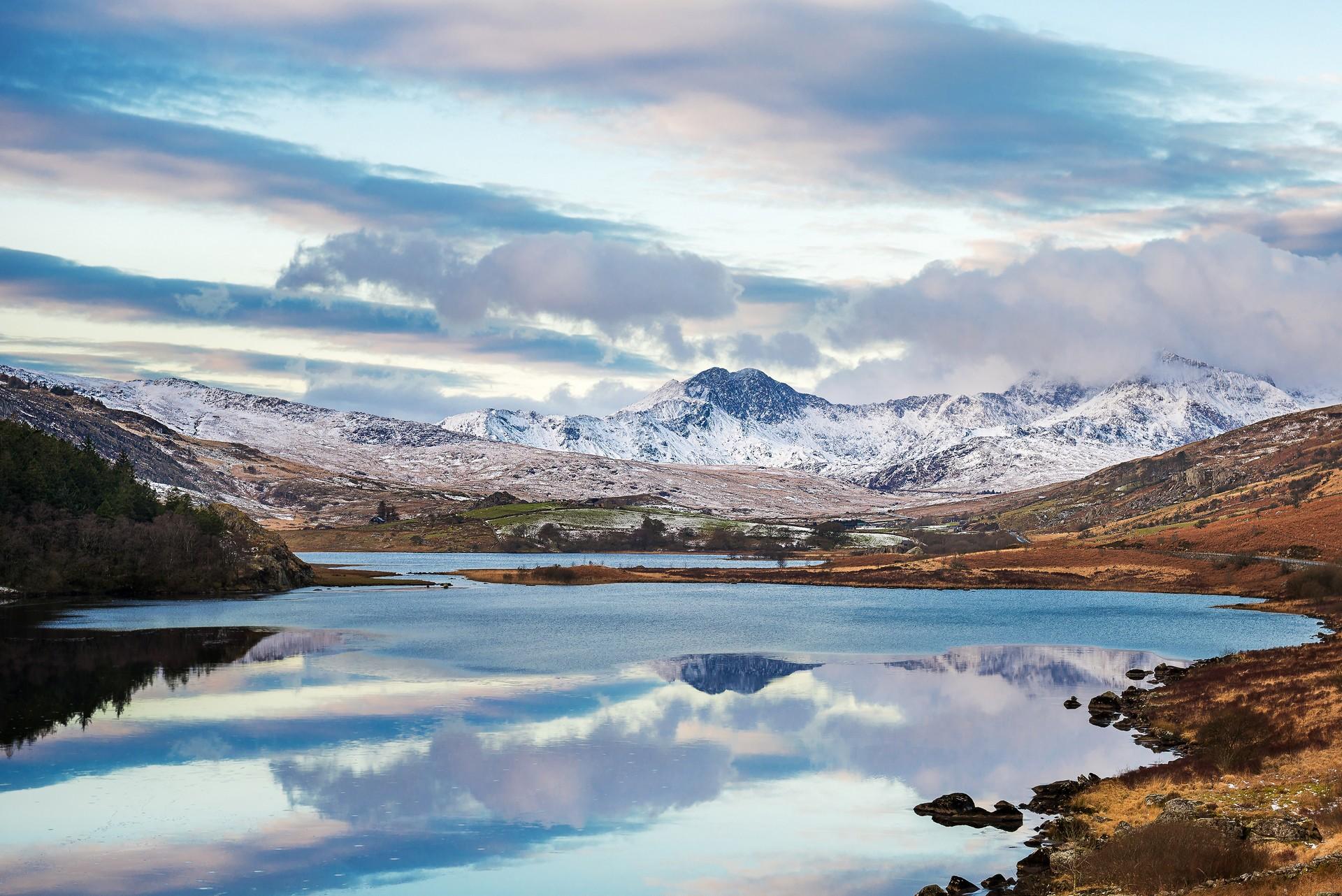 Mountain range in Snowdonia in partly cloudy weather