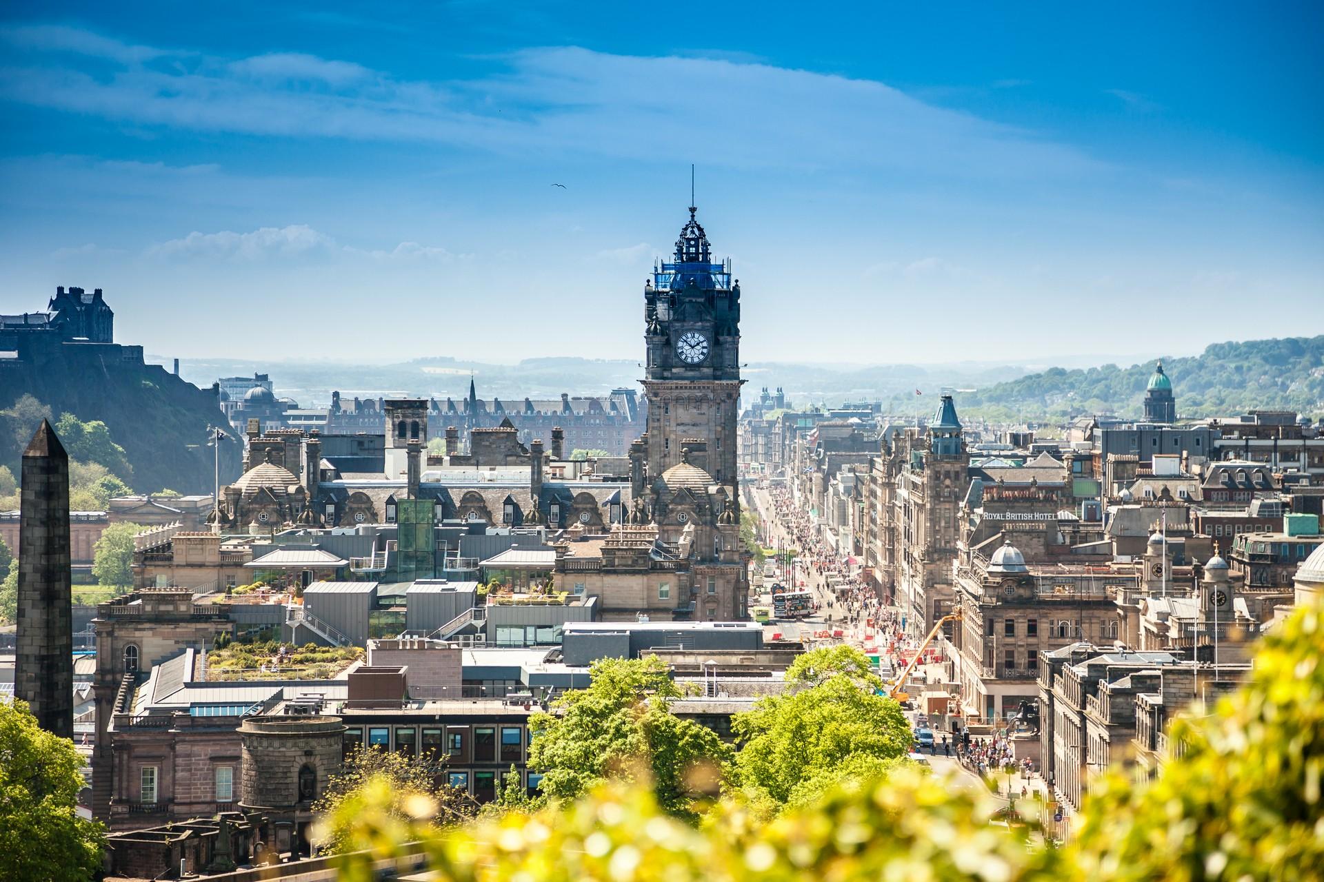 Aerial view of architecture in Edinburgh in sunny weather with few clouds