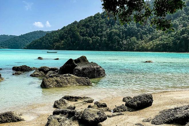 View of rocks, sandy beach, forest and sea in a National Park in Thailand