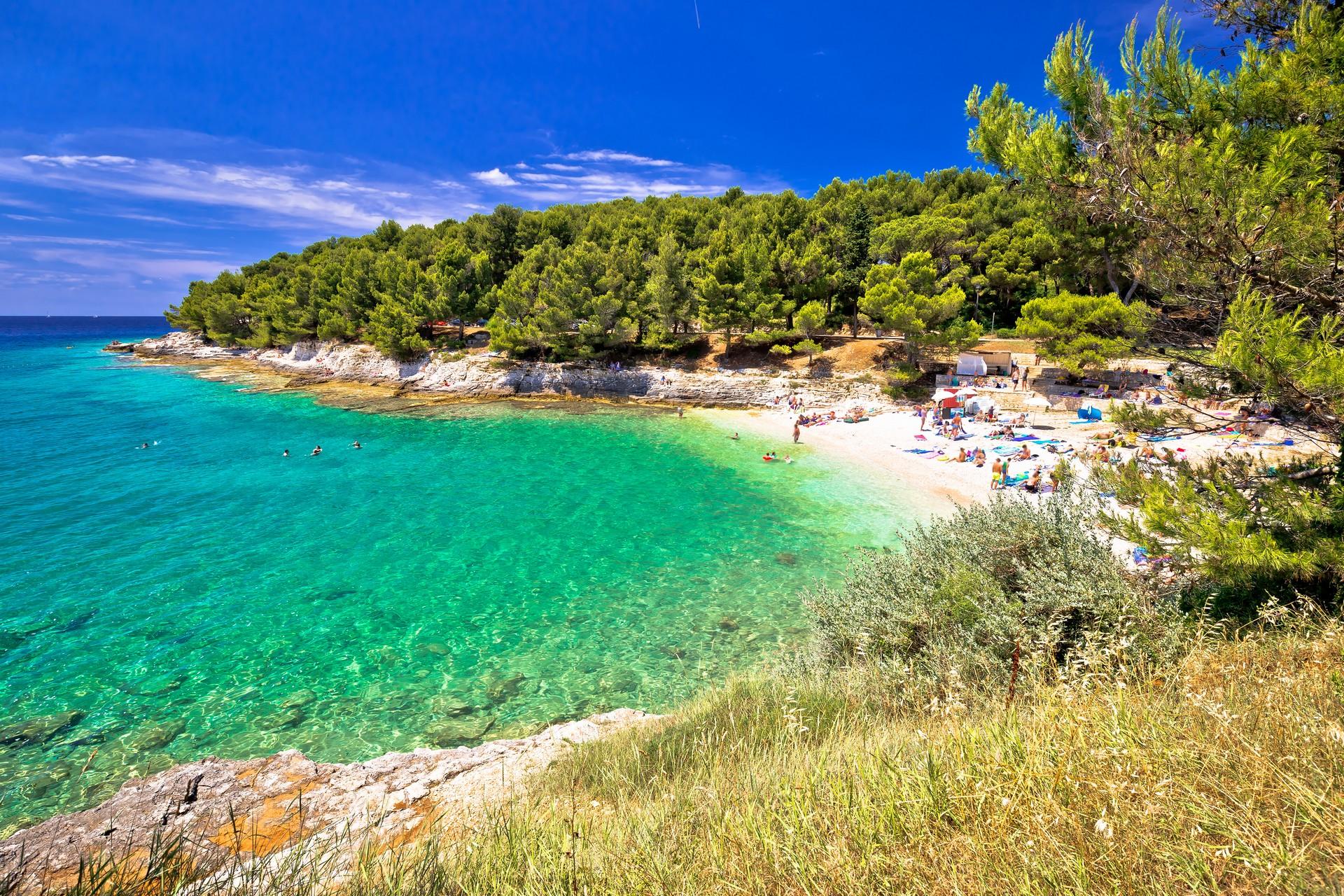 Enjoyable beach with turquise water near Pula on a sunny day with some clouds