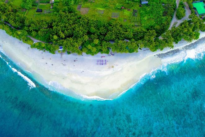 The inhabited island of the Maldives and its beach