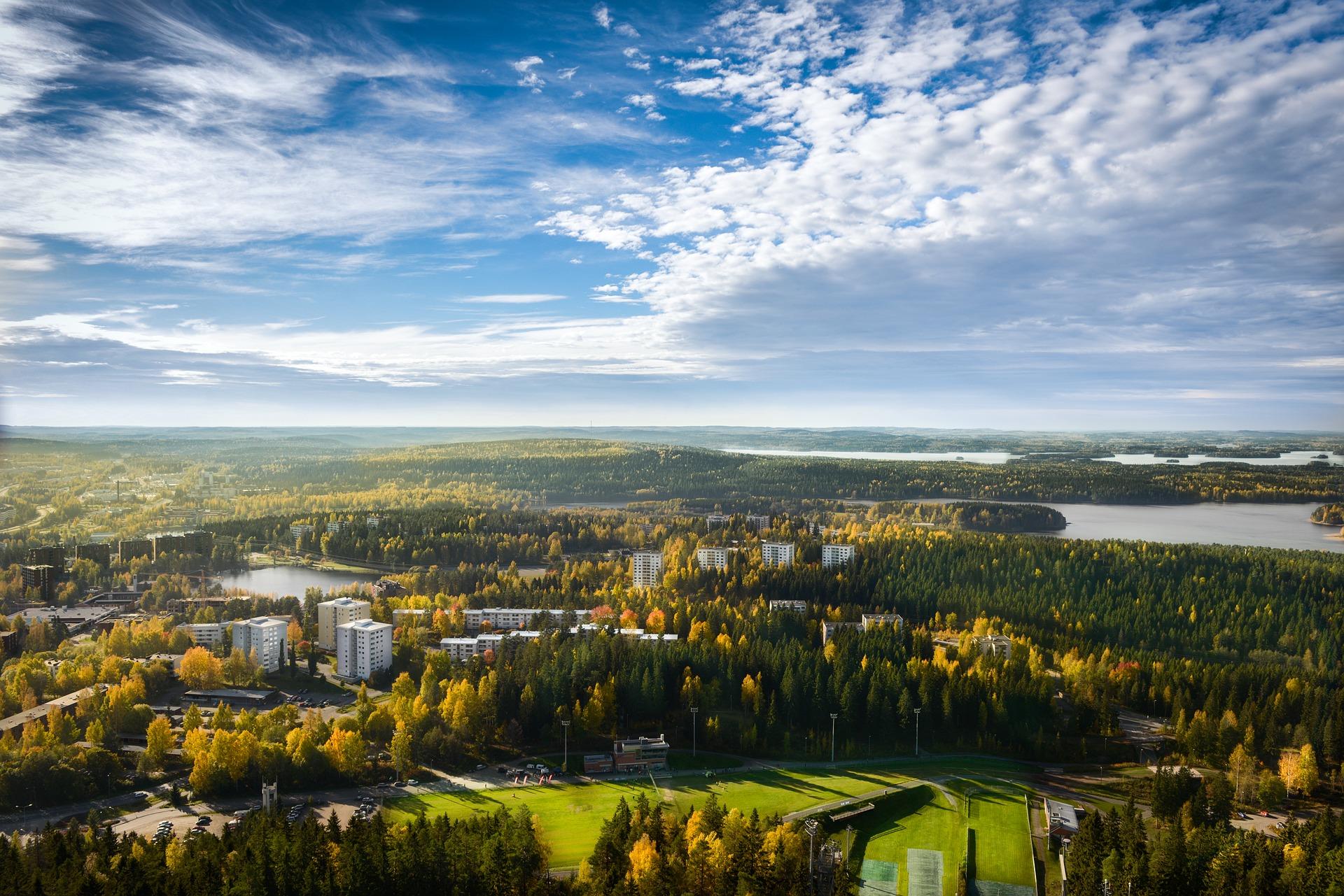 Aerial view of countryside in Kuopio in sunny weather with few clouds
